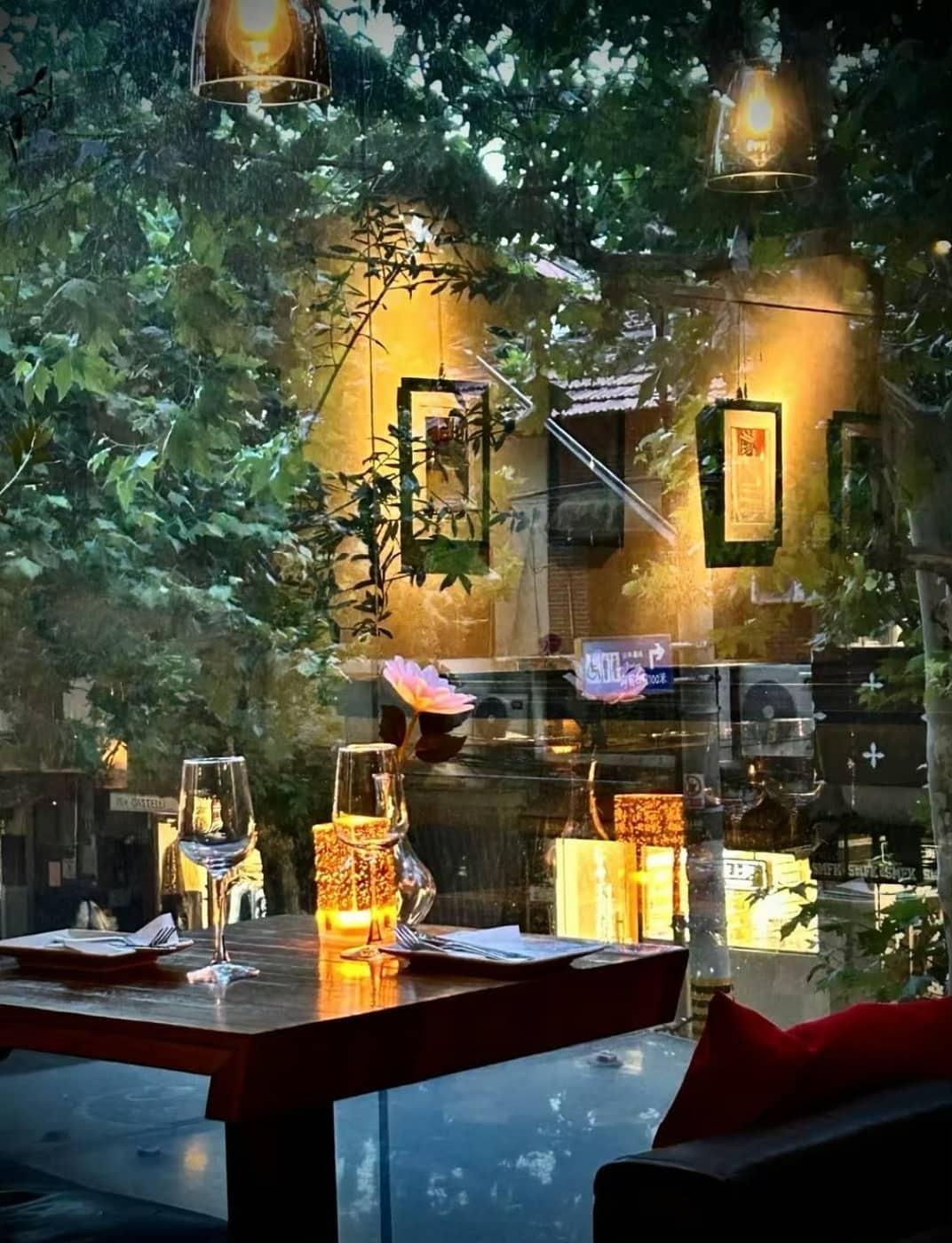 Evening table looking onto a Shanghai plane-tree street